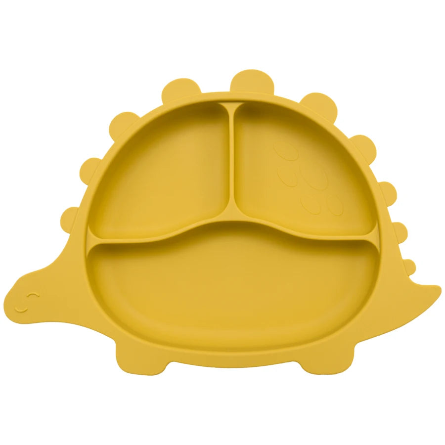Présentation d'une assiette pour bébé jaune en forme de dinosaure, avec des compartiments.