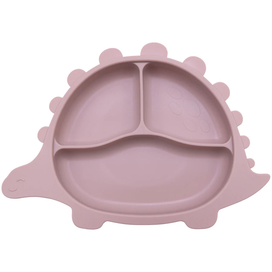 Présentation d'une assiette pour bébé rose clair en forme de dinosaure, avec des compartiments.