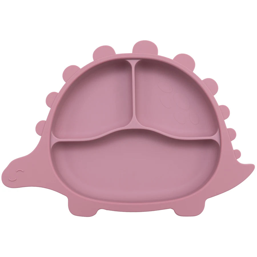 Présentation d'une assiette pour bébé rose foncé en forme de dinosaure, avec des compartiments.