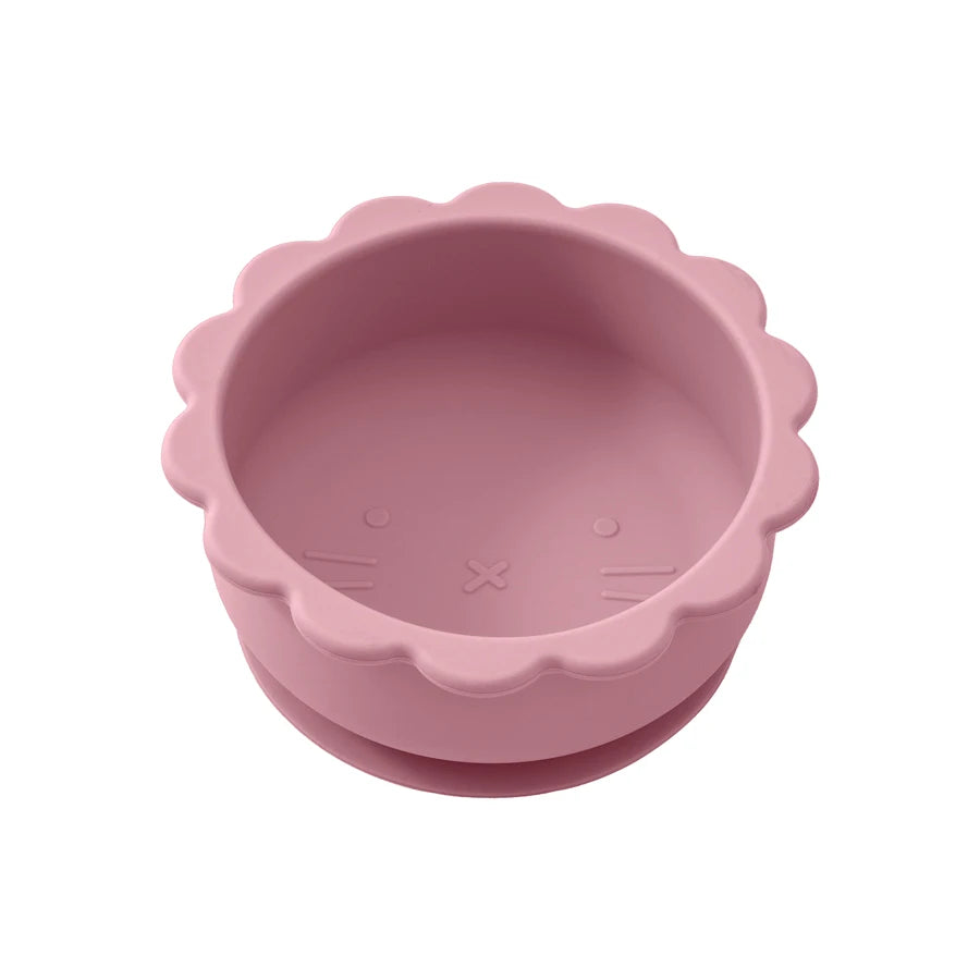 Présentation d'un bol anti-déversement pour bébé en silicone rose foncé.